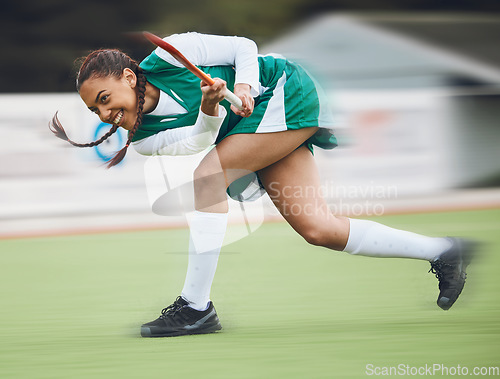 Image of Hockey, sports or girl running in game, tournament or competition with ball, stick or action on turf. Blur, woman training or fast player in exercise, workout or motion on artificial grass for speed