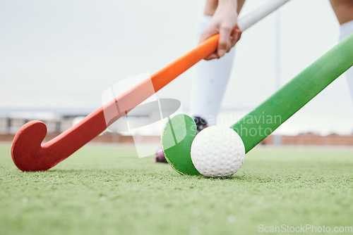 Image of Hockey stick, sports or people on turf in a game, tournament or competition with ball or action. Fitness, athletes training or players in exercise, workout or closeup on artificial grass or ground