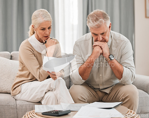 Image of Man, woman and worried with documents for retirement, financial planning or budget. Mature, couple and family with paperwork, savings or calculating for future, discussion and together in living room