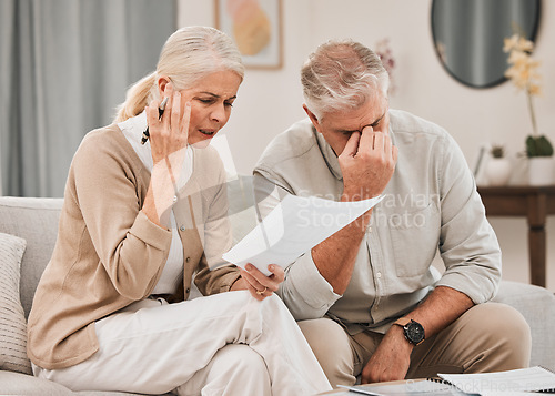 Image of Married, couple and together with documents in frustration for finances, vacation or retirement at home. Elderly, man and woman on sofa with paperwork with bad news for plan, investments or budget