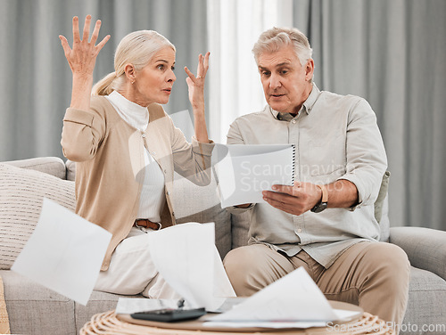 Image of Debt, old couple with documents and stress in home, mortgage payment and retirement funding crisis. Financial budget, senior man and woman on sofa with anxiety for bills, life insurance and taxes.