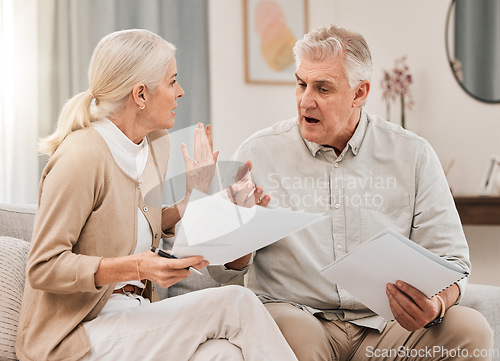 Image of Bills, old couple with documents and stress in home, mortgage payment and retirement funding crisis. Financial budget, senior man and woman on sofa with anxiety for debt, life insurance and taxes.