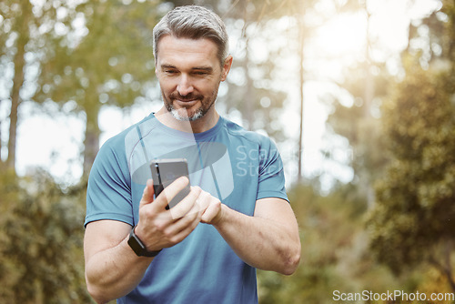 Image of Man, phone and outdoor with exercise clothes or smile for communication or conversation in sport. Male, health and smartphone for cardio app and workout for strong, athlete or happy in nature
