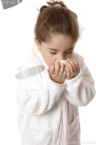 Image of Little girl sniffing fragrant soap