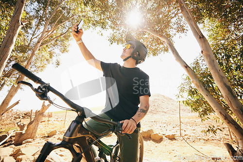 Image of Bicycle, selfie and man with fitness, outdoor and social media with exercise, post and lens flare. Person, athlete and biker with photography, cycling and workout with influencer, sports or internet