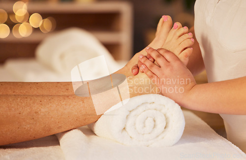 Image of Pedicure, foot therapist and massage at spa for acupressure treatment, wellness therapy and zen. Closeup, client and relax feet at beauty salon for muscle reflexology, circulation or skincare service