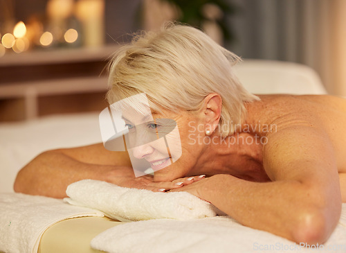 Image of Happy woman, senior and relax on spa table for skincare treatment, holistic physical therapy and healing at beauty salon. Face of customer at luxury wellness resort for massage, holiday or calm detox