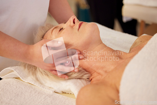 Image of Relax, face massage and senior woman at a spa for health, wellness and anti aging skincare treatment. Calm, beauty and elderly female person in retirement with wrinkles face routine at natural salon.
