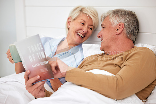 Image of Bed, book and senior couple with love, conversation and marriage with creativity, relax and retirement. Novel, storytelling and old woman with elderly man, bedroom and home with discussion or resting