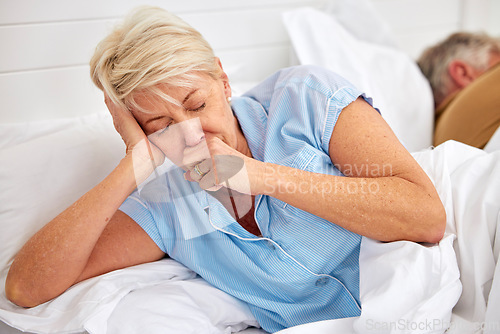 Image of Couple, coughing or sick old woman in bed with husband or man with flu virus, tuberculosis or health problem. Chest pain, mature lady or senior person with cold, fever or lung illness in home bedroom