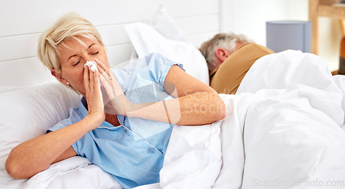 Image of Blowing nose, couple or sick old woman in bed with husband with flu virus, cold or health problem. Sneeze, mature or senior person with tissue toilet paper, fever or allergy illness in home bedroom