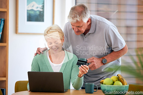 Image of Online shopping, mature or happy couple with laptop, credit card or discount code for digital product at home. Coffee, ecommerce promo or senior people on fintech website for payment or sale search