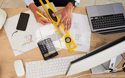 Image of Architecture, hands and drawing on desk with design, top of workspace with engineering and tech. Architect person with illustration, floor plan paperwork for construction project and productivity