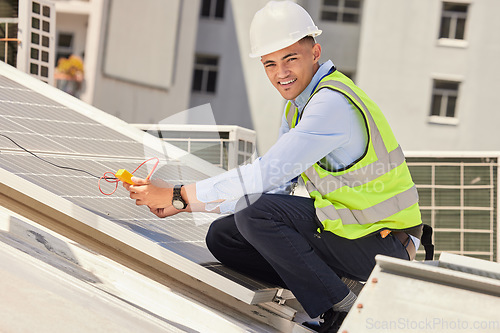 Image of Portrait, engineer and man with solar panel, clean energy and construction with a hard hat, industry or smile. Worker, employee or technician with installation, innovation or sustainability on a roof