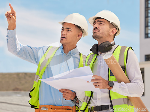 Image of Industrial, blueprint and team of construction workers in the city planning maintenance or repairs on rooftop. Engineering, discussion and men industry employees in collaboration working on building.