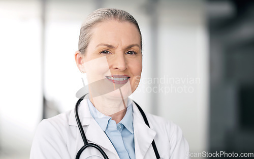 Image of Mature doctor, portrait and happy woman in hospital for healthcare, wellness or career in clinic. Face, medical professional smile and confident expert surgeon, therapist worker or employee in Canada