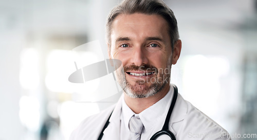 Image of Mature doctor, portrait and happy man in hospital for healthcare, wellness and career in clinic. Face, medical professional smile and confident expert surgeon, therapist worker and employee in Canada