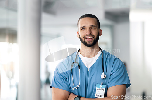 Image of Smile, nurse and portrait of man with arms crossed in hospital for healthcare, wellness or nursing. Face of happy surgeon, confident medical professional and employee, worker and expert in Brazil