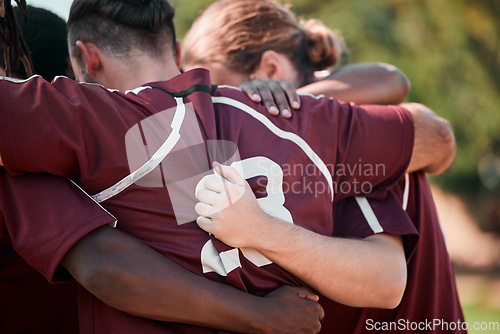 Image of Football team, hug and fitness with sports on field, prayer and motivation with support. Men, diversity and athlete group with collaboration for game, back and solidarity with commitment in circle