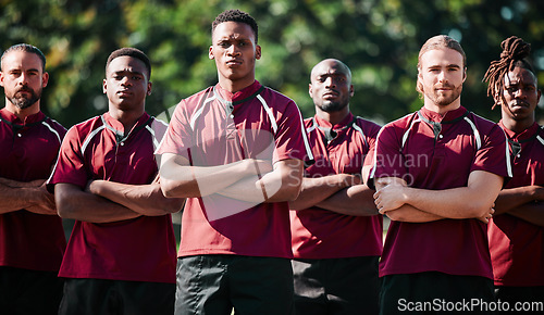 Image of Team, men and field for athlete in portrait with arms folded, united and determined with mindset to win. Diverse group, players and together with intense, rugby sports and face for victory in game