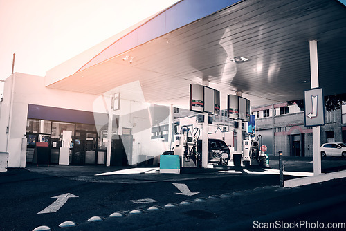 Image of Gas station, cars and fuel for travel or transportation, auto stop and diesel service. Morning, road and and an area for gasoline for transport, oil change or a store for traveling inspection