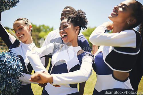 Image of Cheerleaders, field and team with celebration, game and winner with happiness, motivation and smile. Women, men and group cheering, outdoor or chanting with sports, champion with support and excited