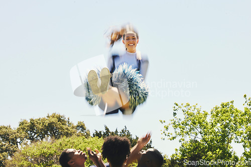 Image of Fitness, energy and woman cheerleader on a field for motivation or support practice with team. Sports, cheerleading and female athlete training in air and dance with blur motion at competition.