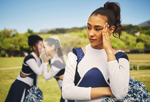 Image of Bullying, cheerleader or friends with gossip about woman, talking behind back and secret on field. School, sports or students speaking of a sad girl teenager with rumor, problem or conversation