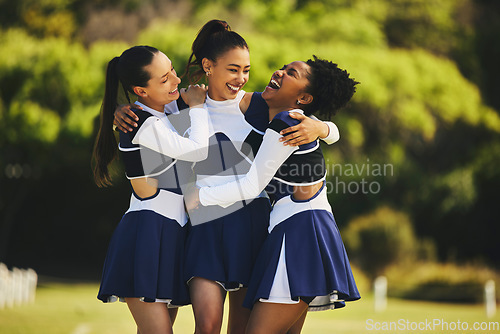 Image of Teamwork, hug or happy cheerleader with women outdoor in training or sports event together. Celebrate, smile or proud friends or excited cheer squad group on field for support, winning or fitness