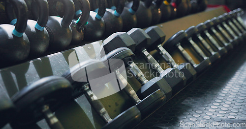 Image of Dumbbell, weight and close up at gym for strong sport or wellness workout, training or goals. Exercise membership, workout and muscle power or build as athlete competition, performance or motivation
