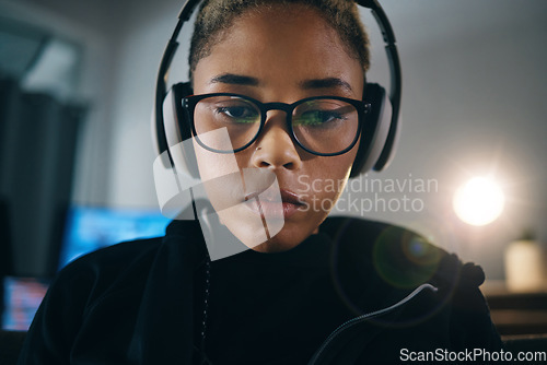 Image of Hacker woman, thinking and night for coding, headphones or idea for cybersecurity, data phishing or ransomware app. Programmer, dark room and brainstorming for it scam, software and research on web