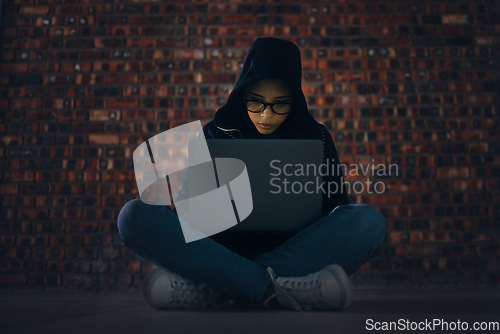 Image of Hacker, woman in basement with laptop and information technology, phishing and cyber crime with database or server. Cybersecurity, programming and criminal with pc, ransomware and firewall breach