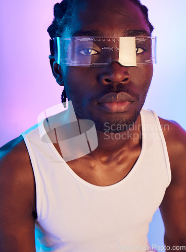 Image of Man, vr or futuristic sunglasses in portrait for fashion, designer brand and style in studio on a neon background. Face of african person in trendy tech, virtual reality vision and metaverse glasses