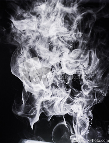Image of Smoke, incense or gas in a studio with dark background by mockup space for magic effect with abstract. Fog, steam or vapor mist moving in air for cloud smog pattern by black backdrop with mock up.