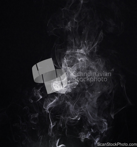 Image of White smoke, creative and art on black background, fog and pattern in vapor, mist and incense. Fumes, smog and steam or air, gas and dry ice effect in abstract, artistic and pollution with mystery