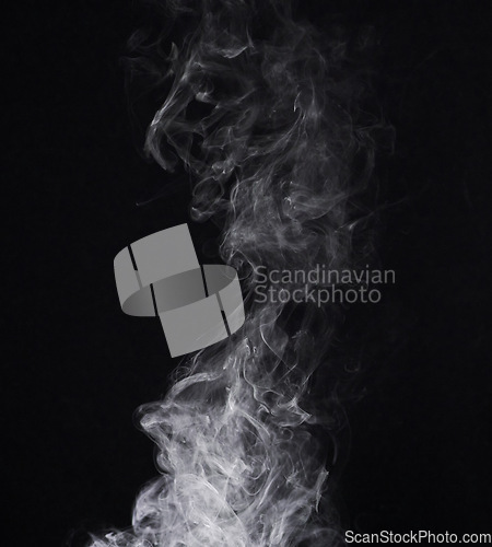 Image of Incense, steam or gas in a studio with dark background by mockup space for magic effect with abstract. Fog, smoke or vapor mist moving in air for cloud smog pattern by black backdrop with mock up.