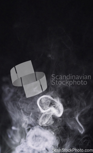 Image of Smoke, black background and steam, fog or gas on mockup space wallpaper. Cloud, smog and magic effect on dark backdrop of mist with abstract texture, pollution pattern or incense vapor moving in air