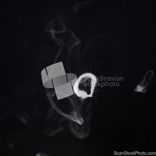 Image of Smoke, steam or pollution with incense on dark background, fog or mist with vapor and mockup space in studio. Dry ice, pattern and texture with environment, gas and air with black backdrop and smog