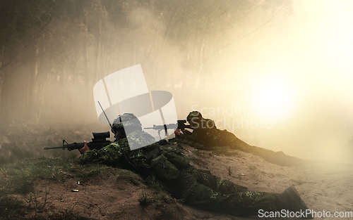Image of Military, war and soldier by smoke on ground, battlefield or fight in forest with army uniform, guns and protection. Warzone, warrior and person in camp look at apocalypse in woods for defence duty