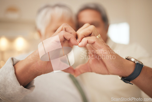 Image of Heart hands, emoji and senior couple in home with commitment, support and marriage in retirement together. Love sign, happy man and old woman in apartment with icon for romantic gesture of loyalty.