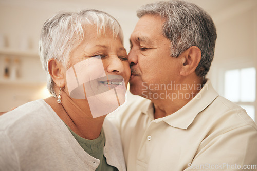 Image of Kiss, smile and senior couple in home with love, support and portrait of marriage in retirement together. Digital photography, face of happy man and old woman in apartment to post on social media.