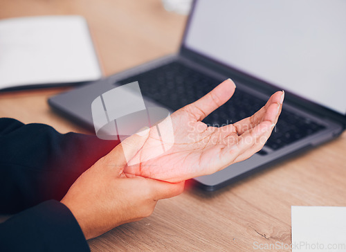 Image of Wrist, pain and business woman with laptop, mockup or screen in office closeup with injury. Hand, red and lady manager with carpal tunnel, arthritis or osteoporosis, joint and fibromyalgia crisis