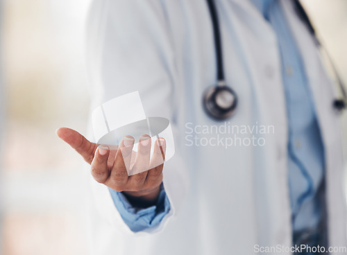 Image of Hand, healthcare and a doctor with invisible or space advertising for artificial intelligence or metaverse innovation. Medical, future and gesture with a medicine professional closeup in a hospital