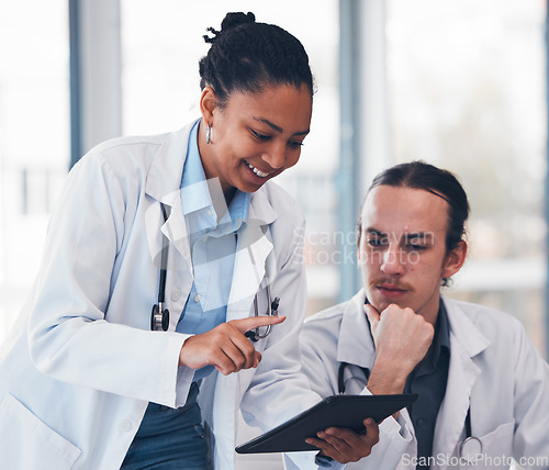 Image of People, doctor and mentor with tablet in hospital for consultation, teaching or training. Diverse team, man and woman in medical care in health, strategy or results for patient, diagnosis and clinic