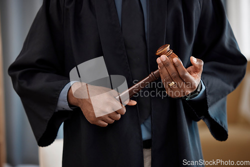 Image of Hands, judge and gavel in courtroom, justice and decision at criminal trial hearing for conflict. Legal expert, hammer and choice for equality, consultation and knowledge for government in court