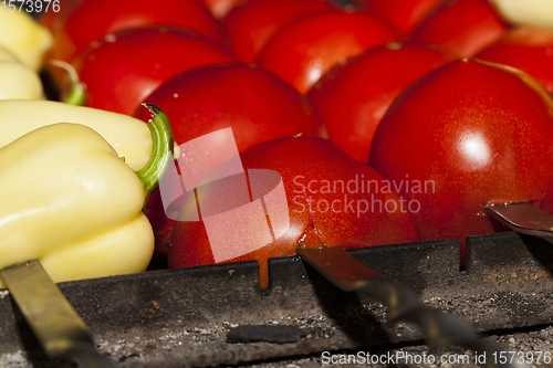 Image of peppers on the coals