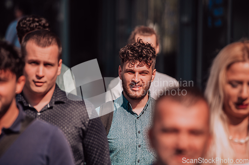 Image of A diverse group of businessmen and colleagues walking together by their workplace, showcasing collaboration and teamwork in the company.