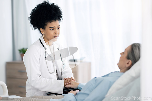 Image of Hospital, doctor and senior patient with care, comfort and empathy for diagnosis news in bed. Healthcare, clinic and health worker with woman holding hands for support, wellness and medical results