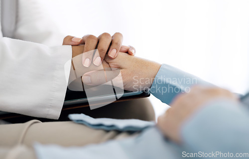 Image of Hospital, holding hands and doctor with patient for care, comfort and empathy for diagnosis news. Healthcare consulting, clinic and health worker with person for support, wellness and medical results