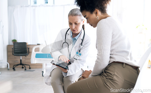 Image of Doctor, women and tablet in medical consultation, hospital meeting and talking of online results, test or feedback. Medical professional and patient reading of digital information or advice in clinic